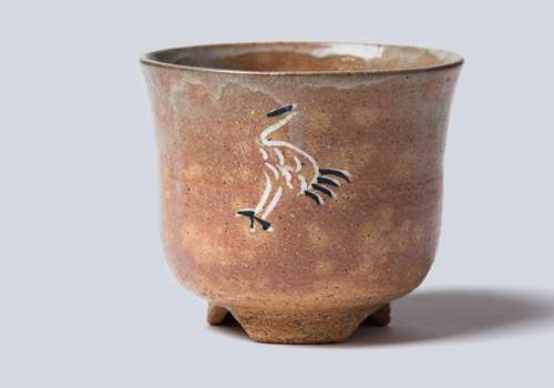 Ceramic tea bowl with a crane on it